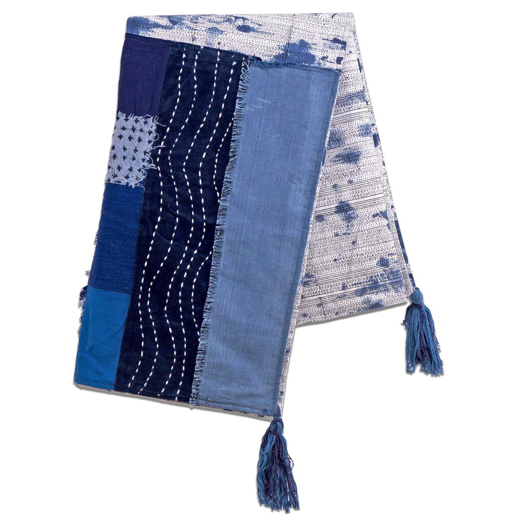 Throw in varying shades of indigo with blue tassled corners 