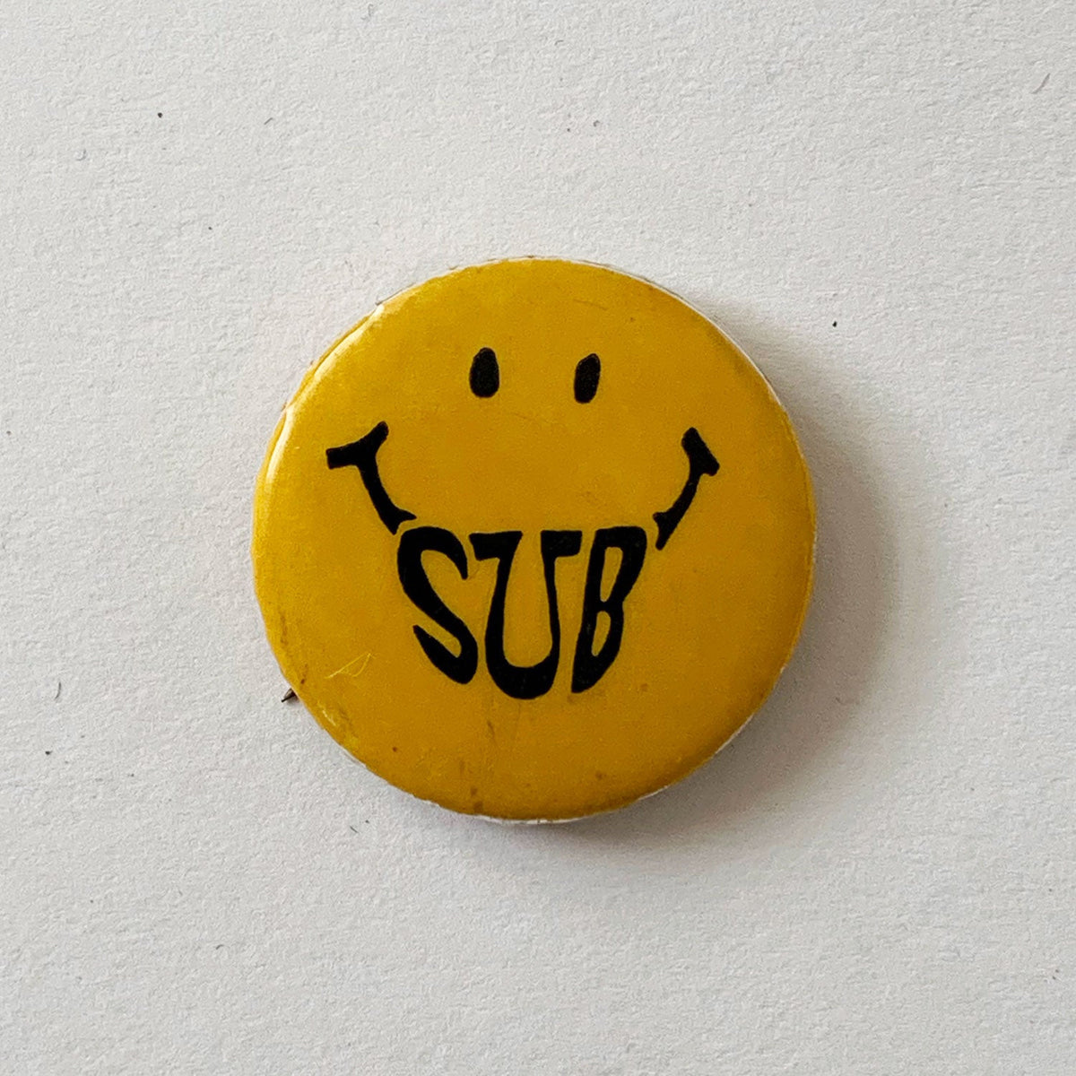 Vintage “SUB Smiley” Pin Button