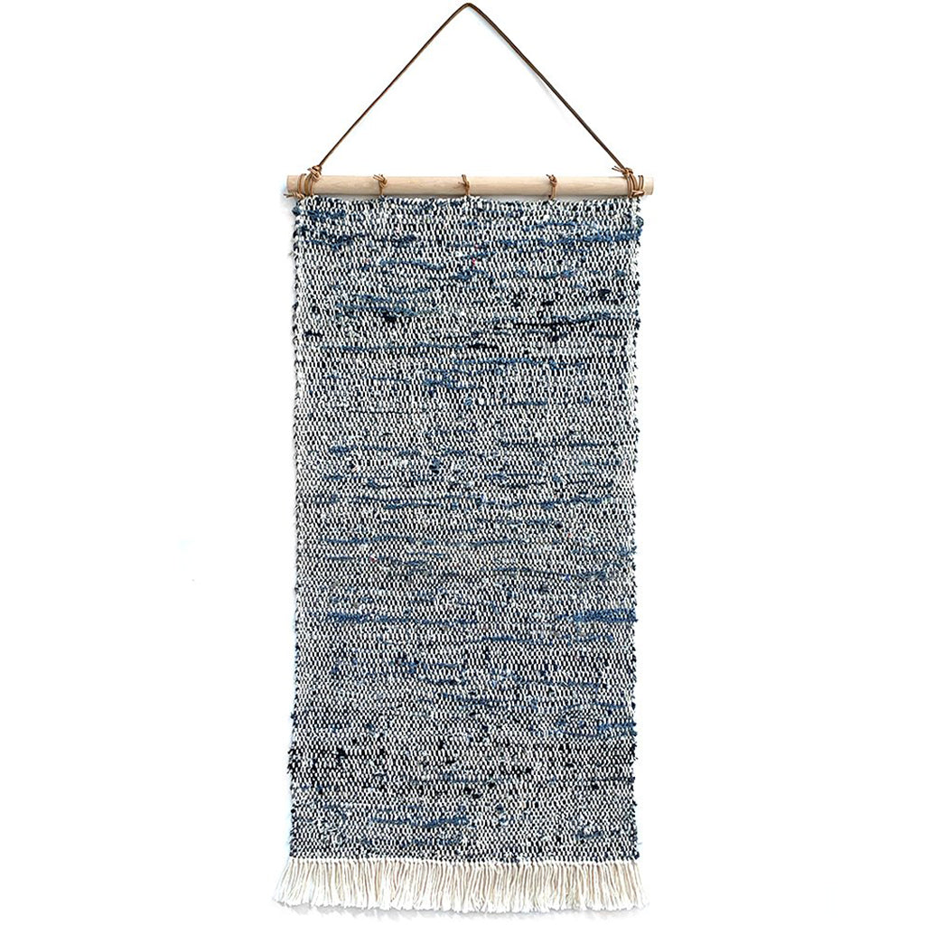 Hand Woven Upcycled Denim Tapestry on a wooden beam with frayed tasseled edges in white 